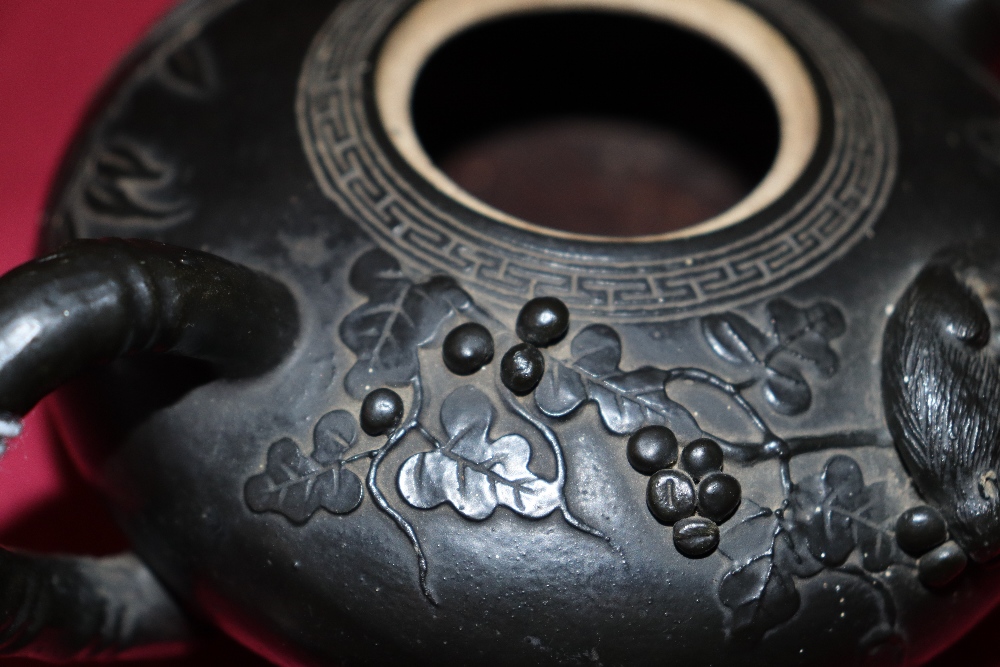 A Chinese black glazed teapot of squat form with raised animal and berry decoration, leaf shaped - Image 10 of 20