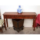 A mahogany hall table fitted eight spice labelled drawers, raised on square section tapering