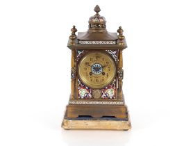 A 19th Century French gilded and Champleve mantel clock, the circular dial supporting an eight day