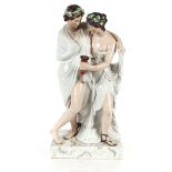A large Staffordshire figure depicting a Bacchanalian couple, on plinth base, 64cm high