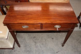 A mahogany single dropleaf side table fitted with two frieze drawers raised on square tapering