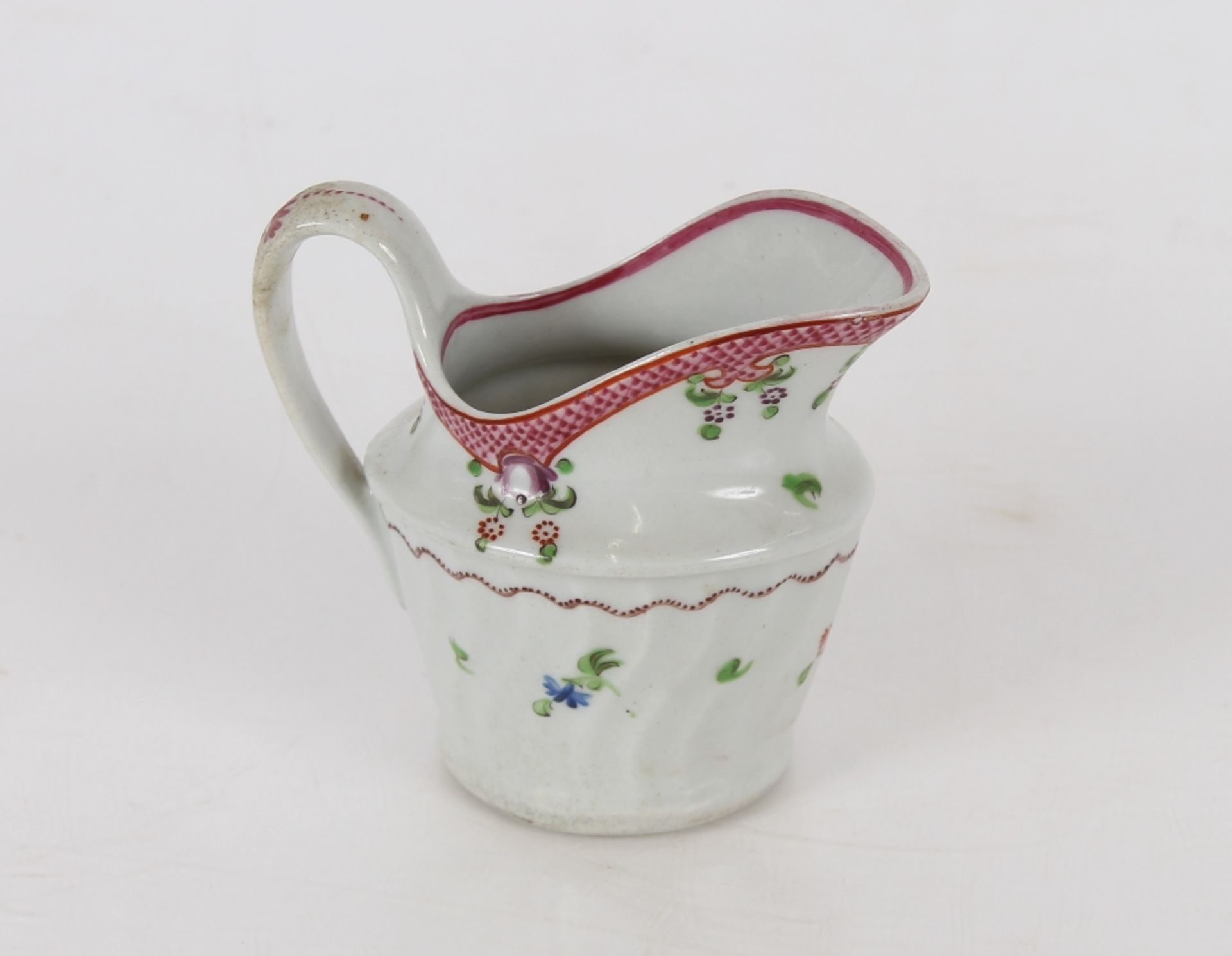 A Newhall porcelain cream jug, of fluted form, floral spray decoration marked N173 to base; and a - Image 2 of 6