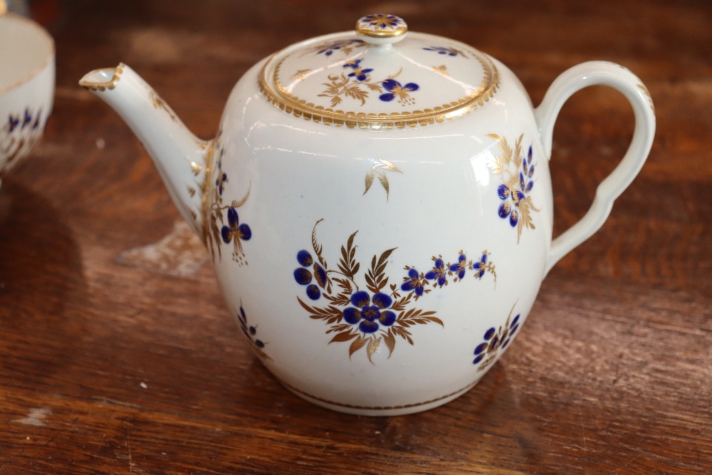 A 19th Century English porcelain part tea set having blue floral decoration heightened in gilt, - Image 23 of 33