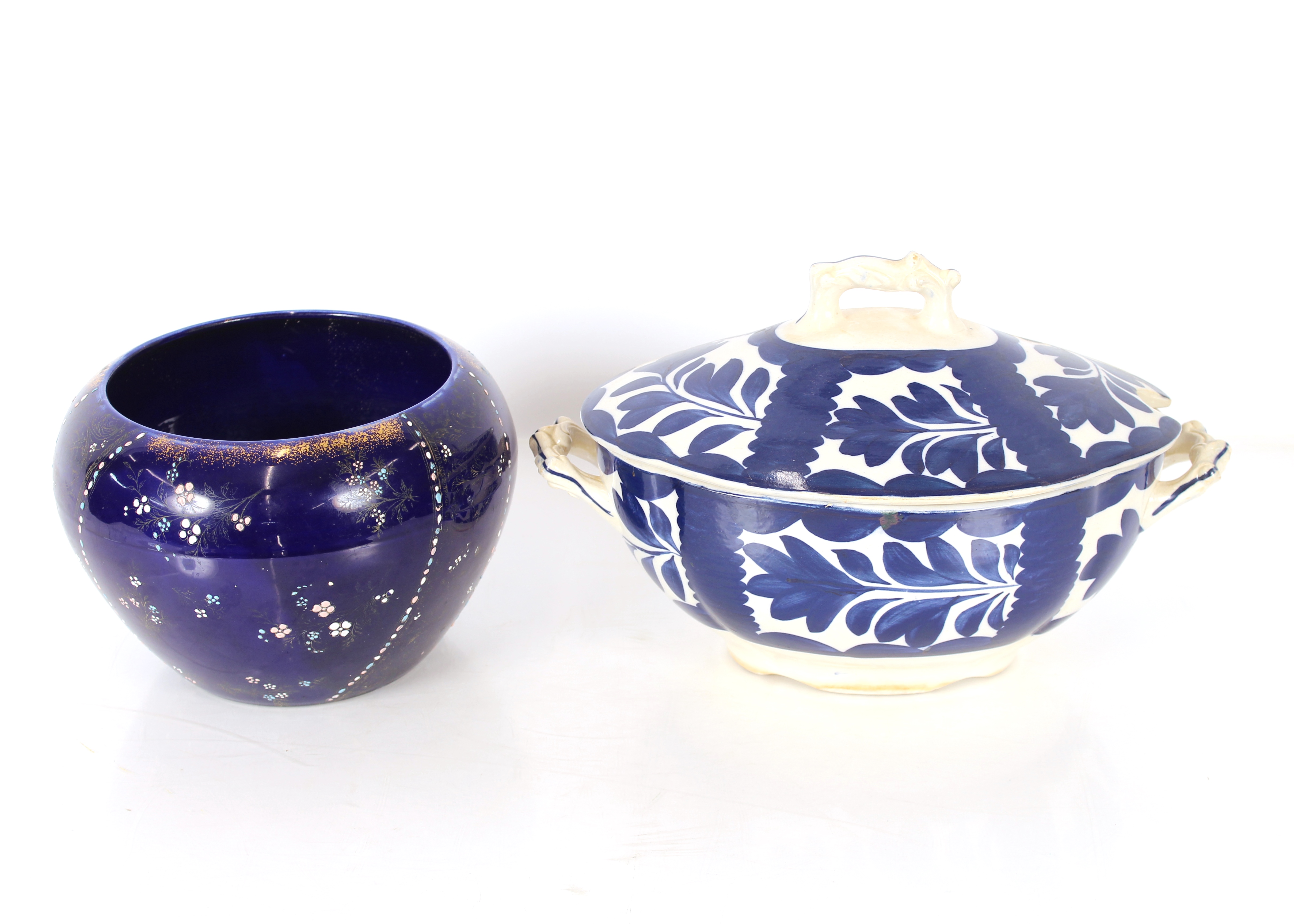 A French blue and white pottery tureen, having stylised floral decoration and an Edwardian blue