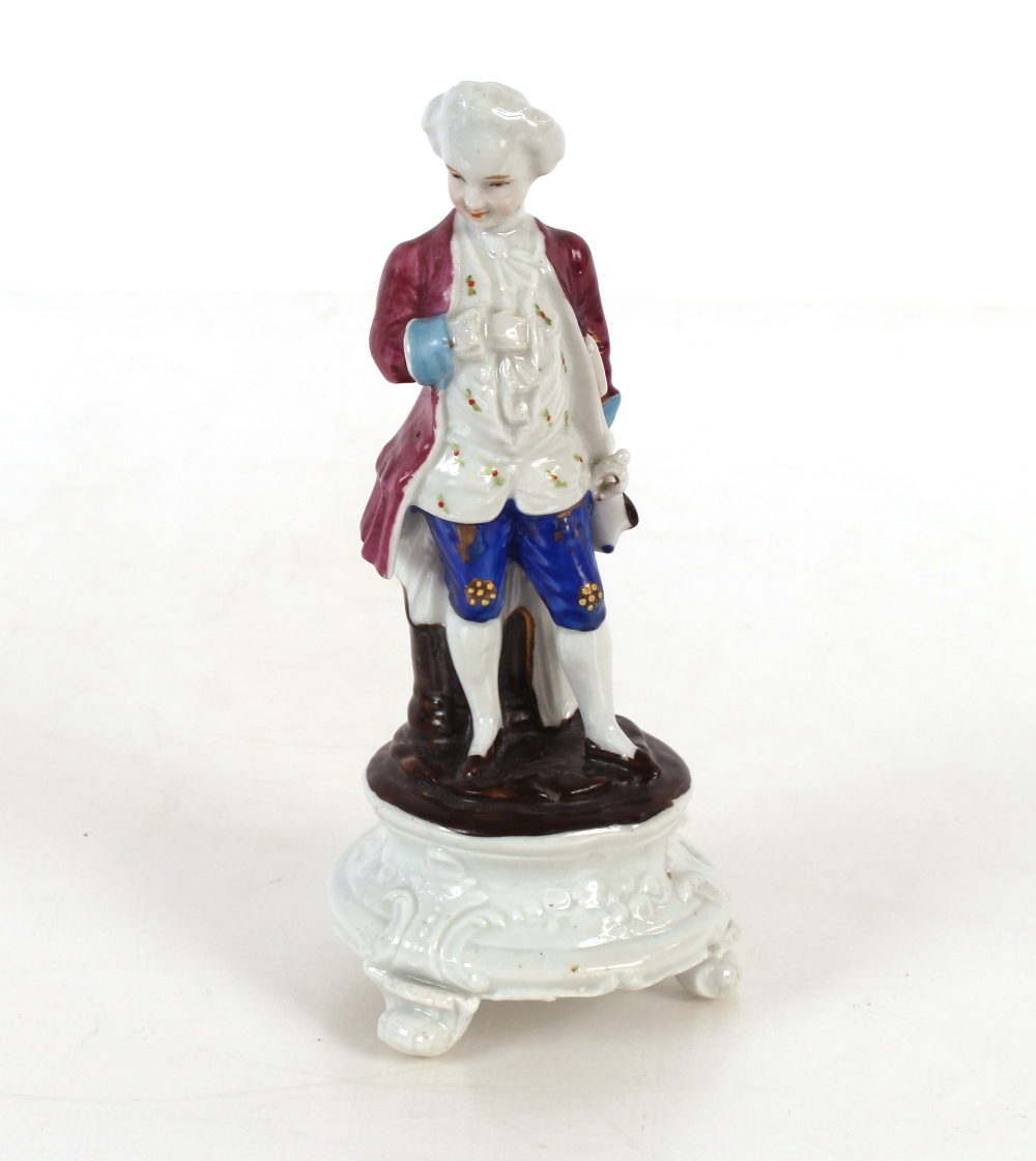 Continental porcelain figure group of a gentleman in breeches reclining against a tree stump; - Image 3 of 3