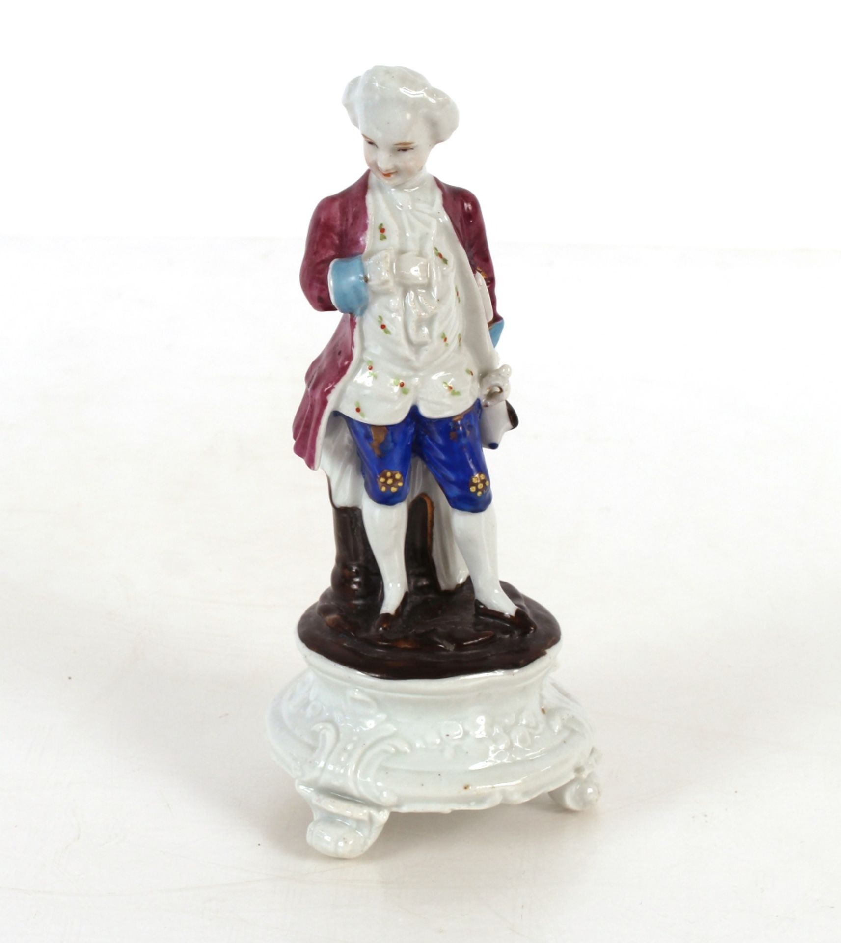 Continental porcelain figure group of a gentleman in breeches reclining against a tree stump; - Image 3 of 3