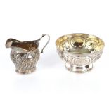 A Victorian silver sugar bowl with raised foliate decoration and monogrammed cartouche, London 1861;