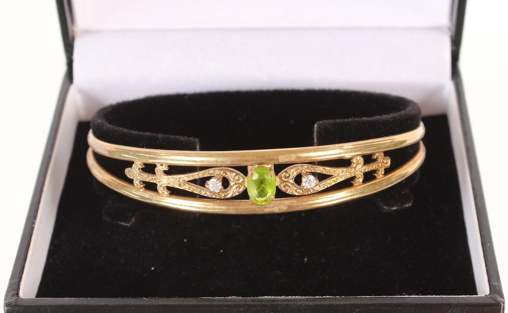 A 9ct gold peridot and white stone bangle, 10.7gms - Image 3 of 6