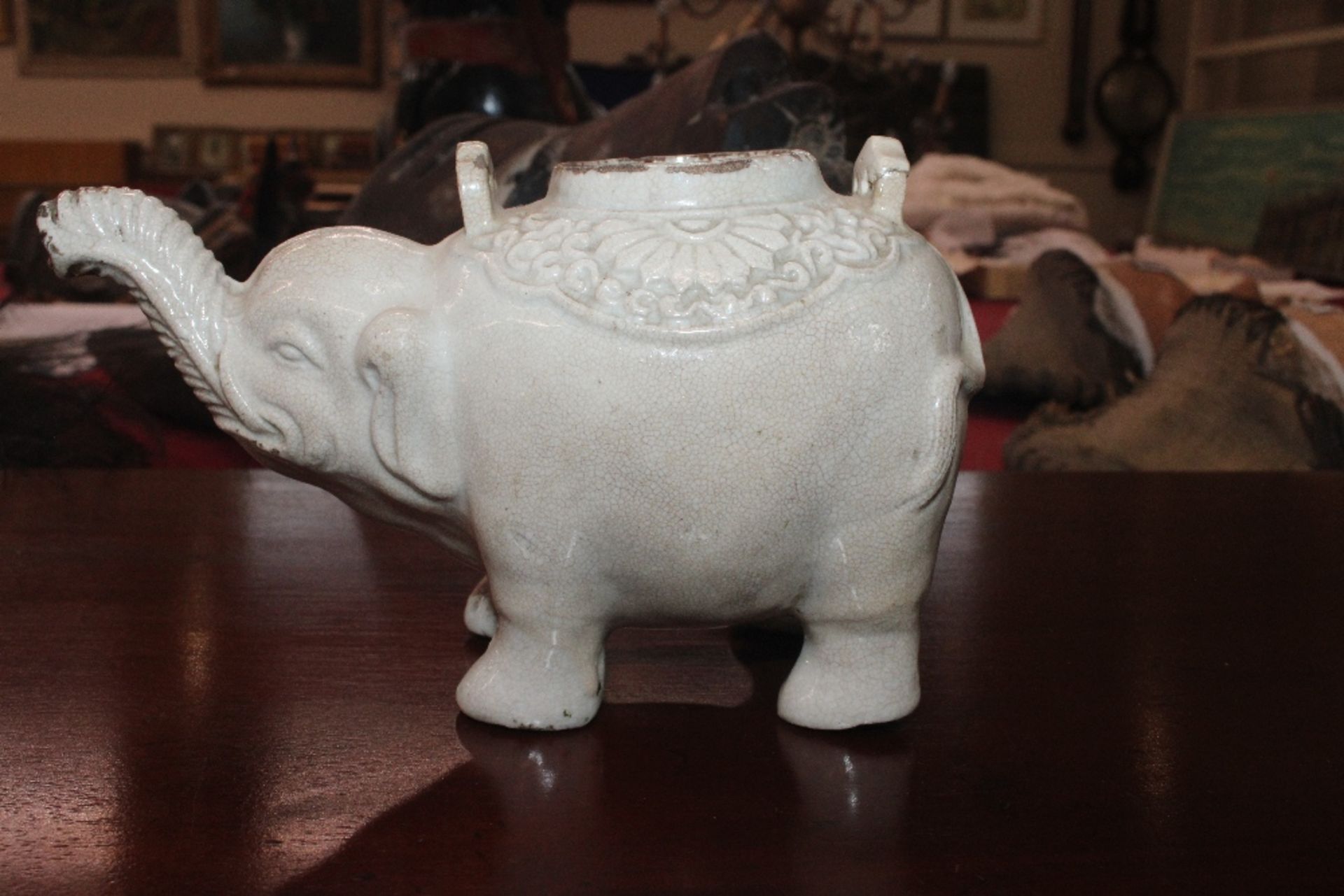 A Chinese blanc de chine water dropper in the form of an elephant, having moulded decoration to - Image 16 of 21