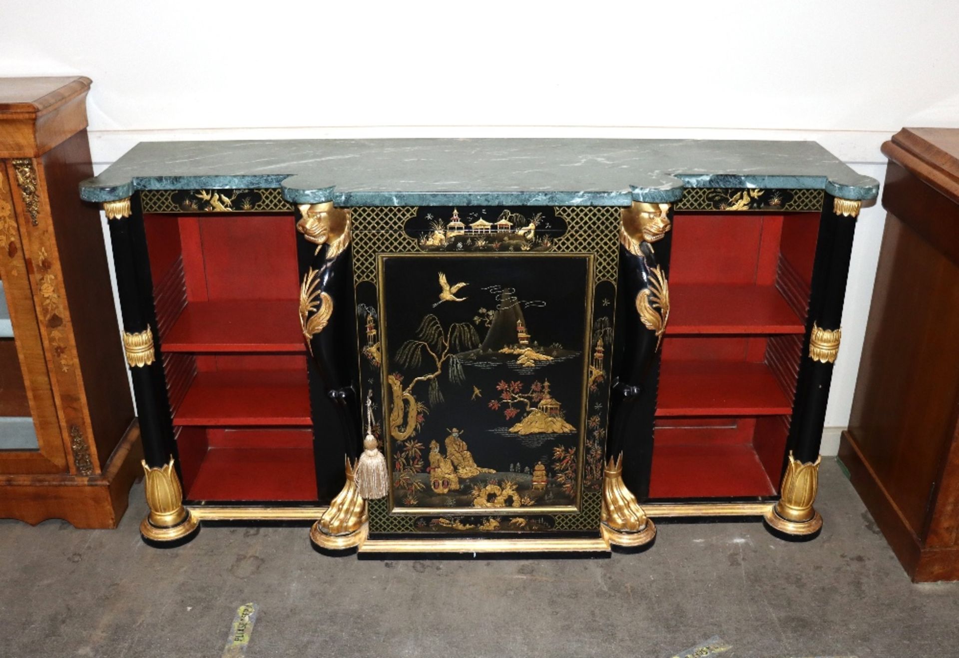 A Chinoiserie decorated credenza surmounted by green marble top, central cupboard and open end