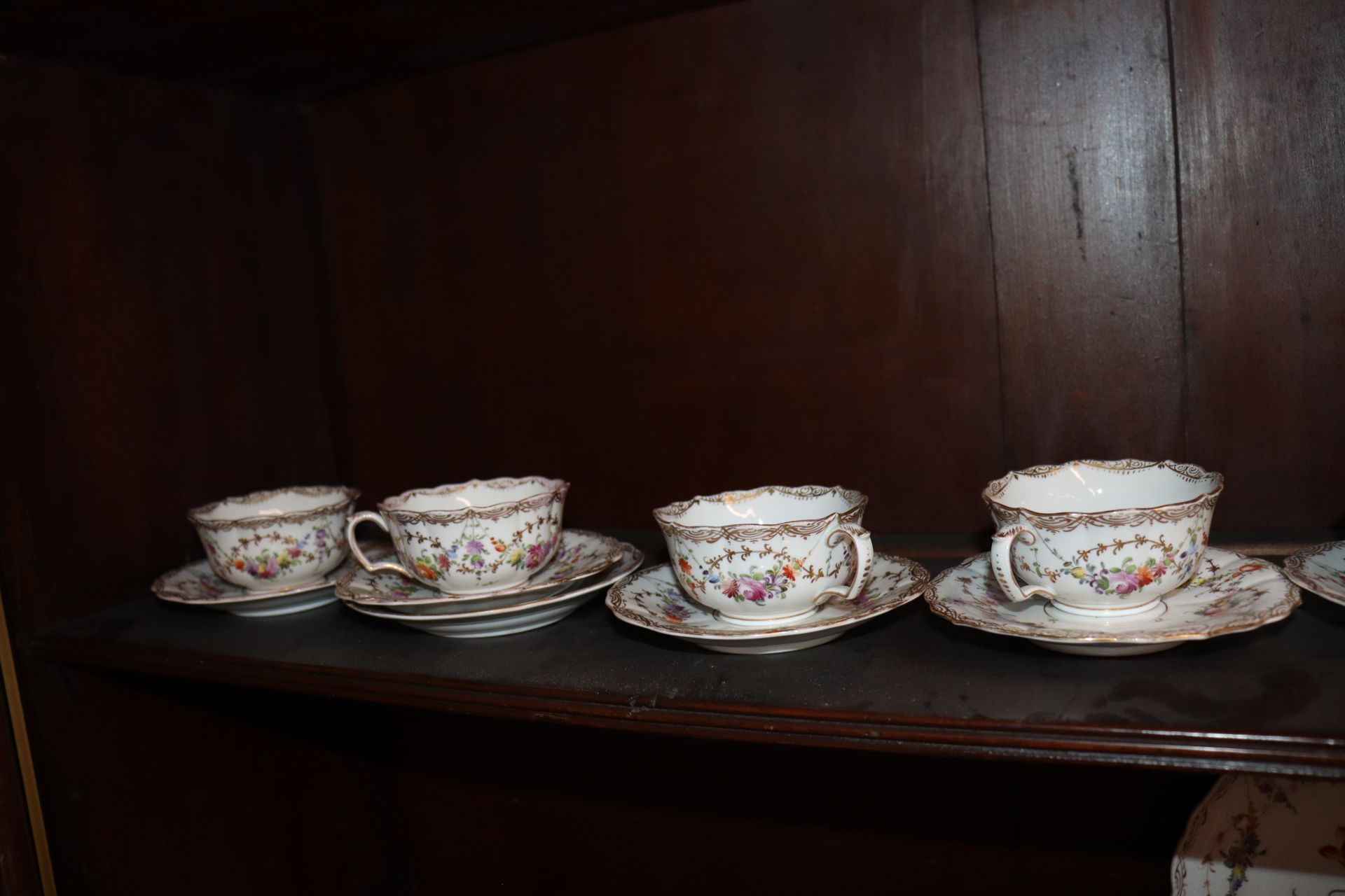 A Meissen part tea set, having painted foliate sprays heightened in gilt within shaped borders, - Image 9 of 9