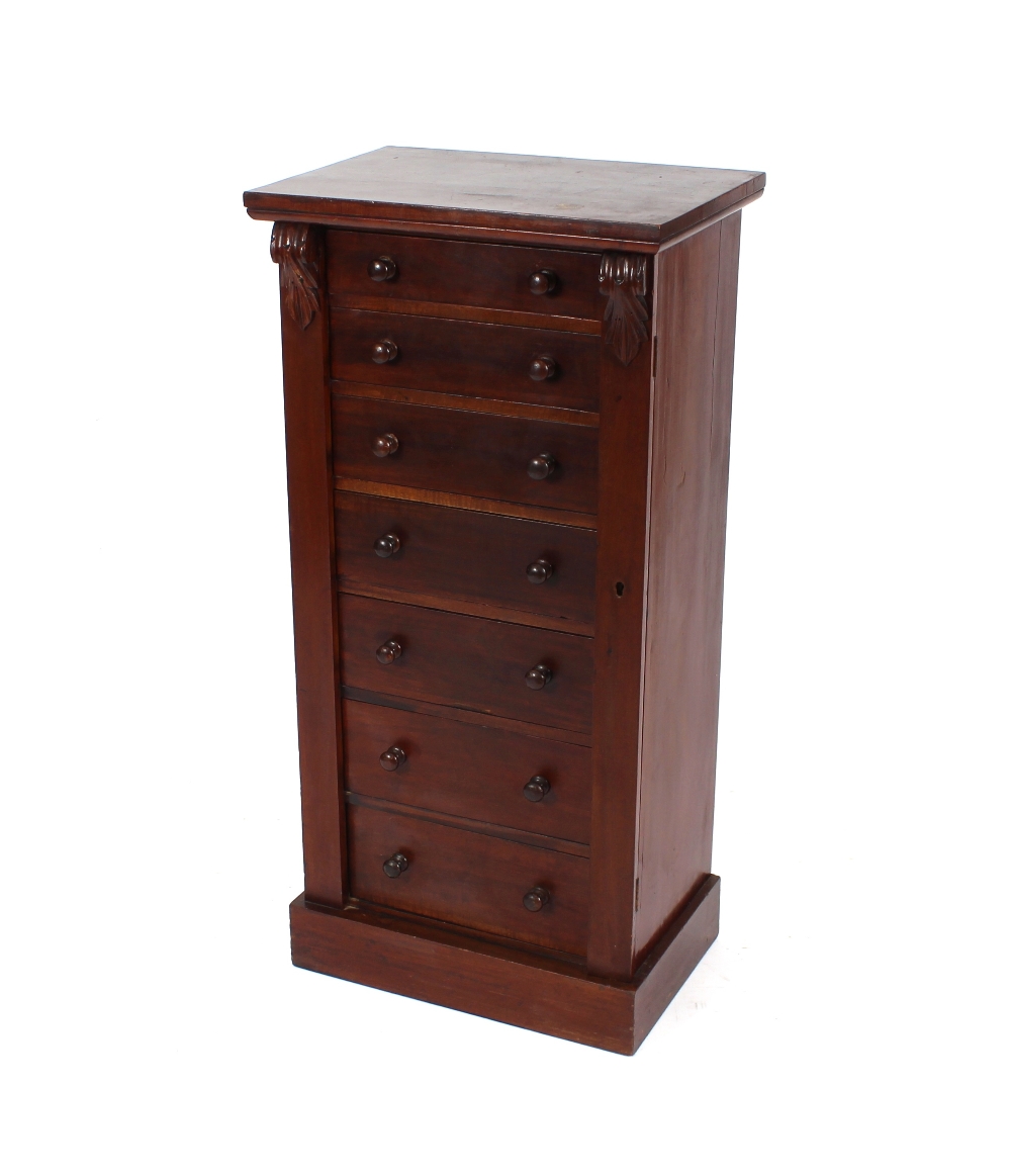 A late Victorian mahogany Wellington chest fitted seven drawers with locking side pillar, raised