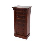 A late Victorian mahogany Wellington chest fitted seven drawers with locking side pillar, raised