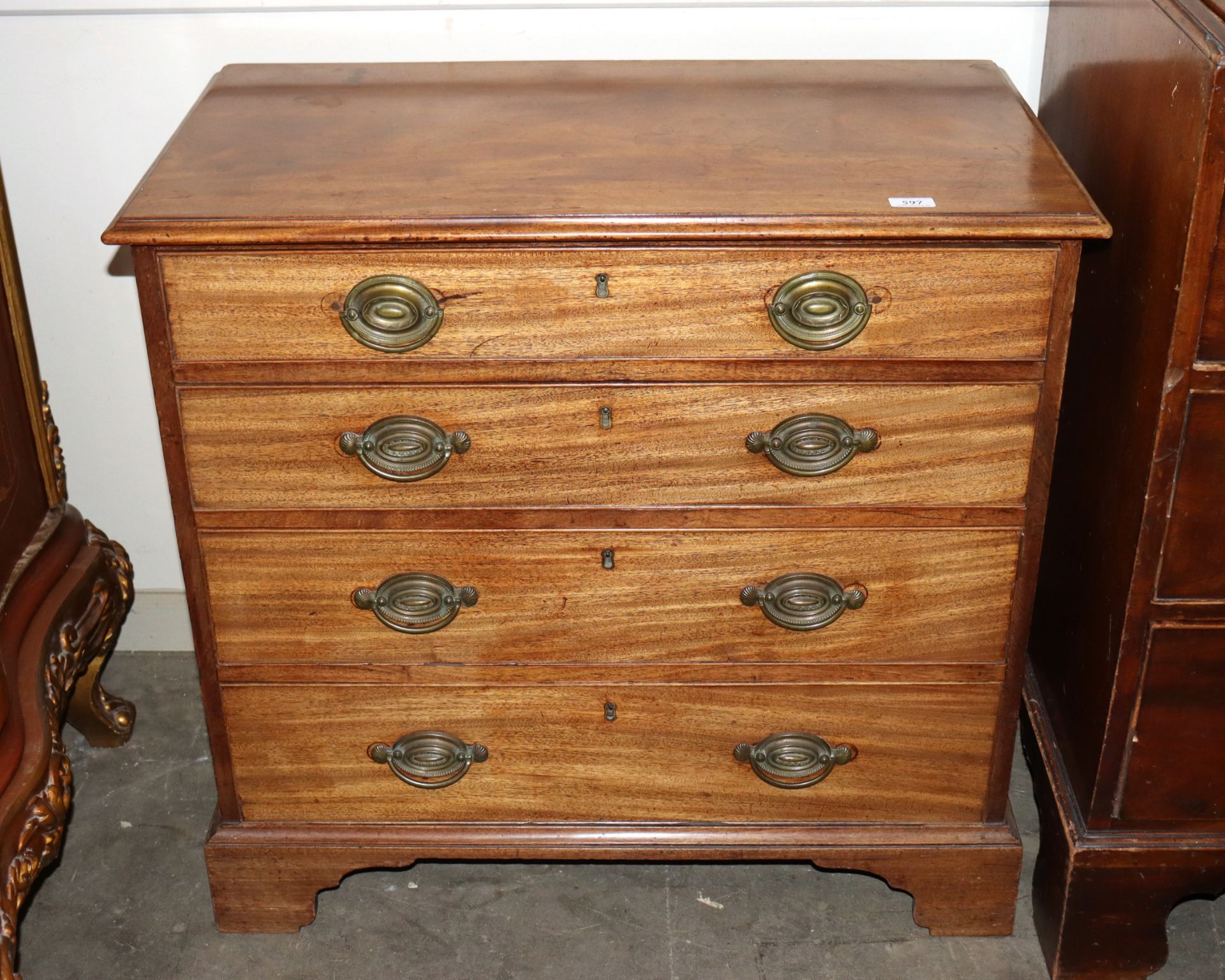 A George III mahogany chest fitted four long graduated drawers raised on bracket feet, 84cm wide x