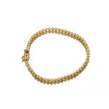 An 18ct gold and diamond set line bracelet, 8.1gms