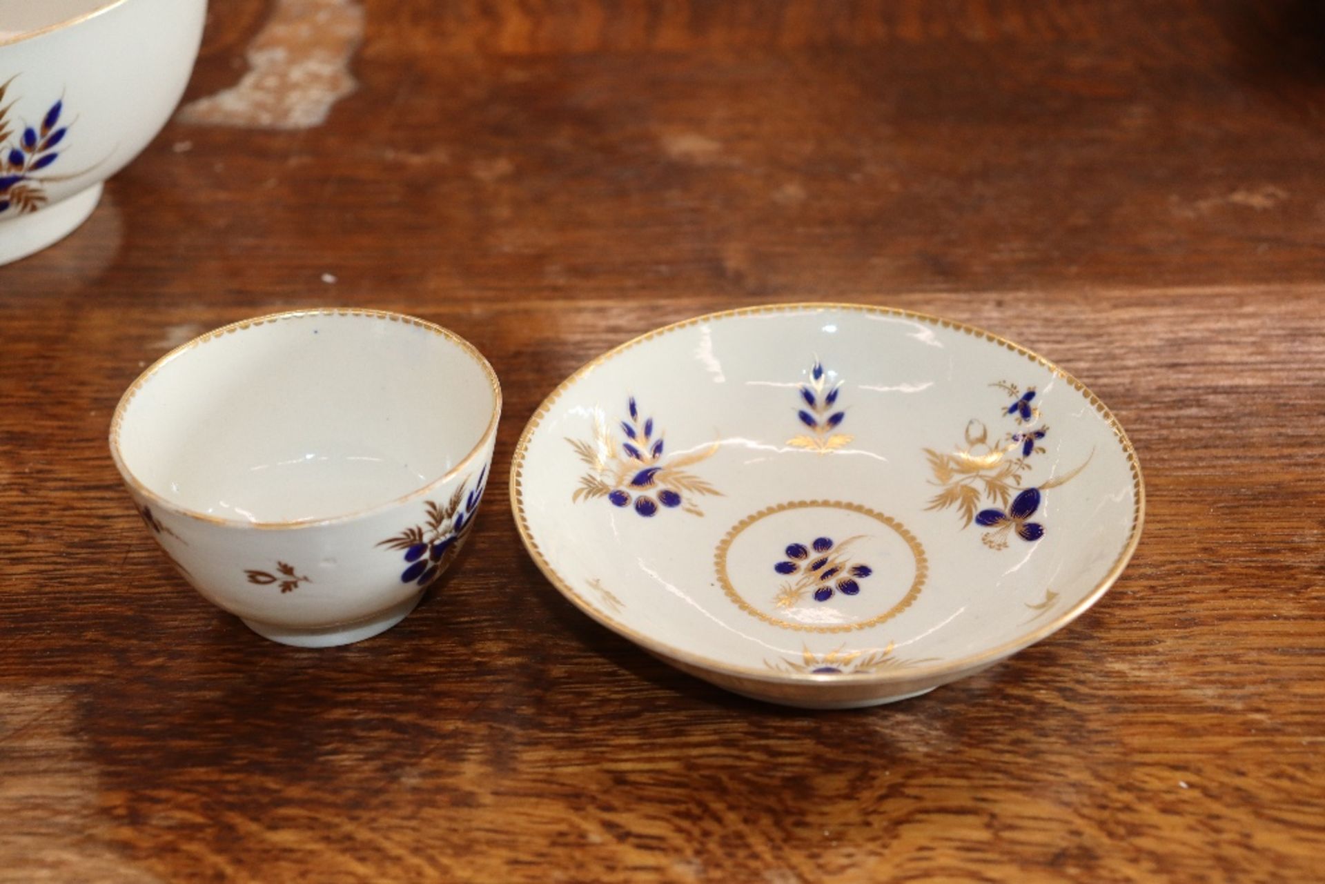 A 19th Century English porcelain part tea set having blue floral decoration heightened in gilt, - Image 4 of 33