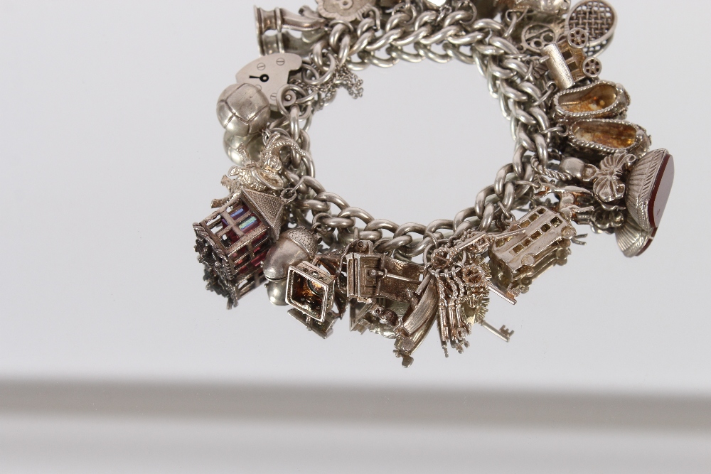 A very large silver charm bracelet, set many charms, 111gms - Image 2 of 5