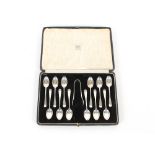 A cased set of twelve silver "Old English" pattern teaspoons and a pair of matching sugar tongs,