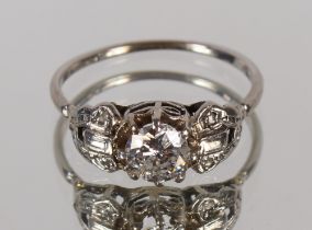 An Art Deco design cluster ring, having large central brilliant cut diamond, approx. ½carat, 3.9gms