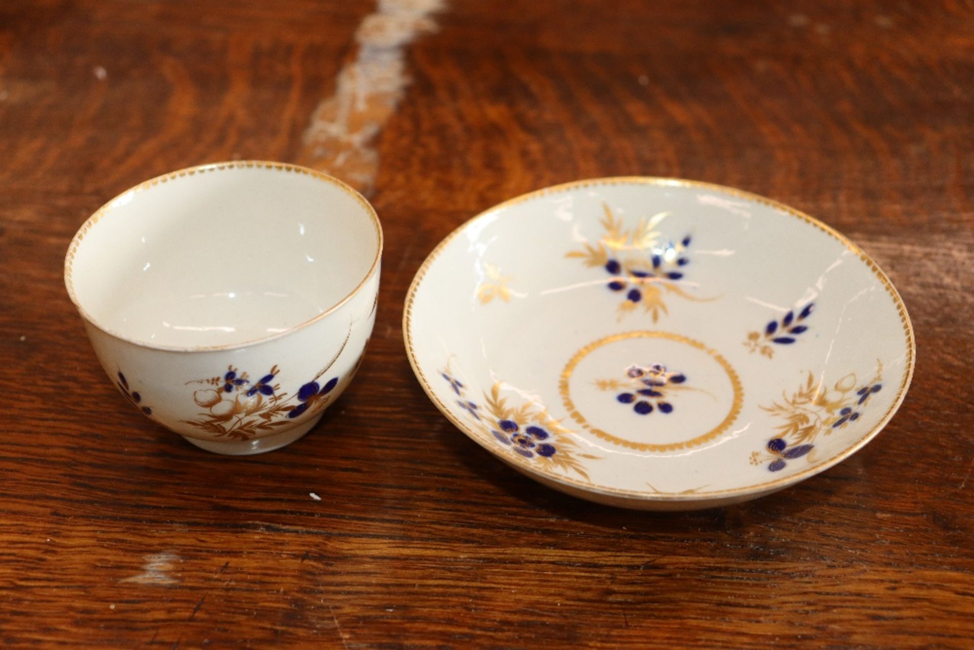 A 19th Century English porcelain part tea set having blue floral decoration heightened in gilt, - Image 19 of 33