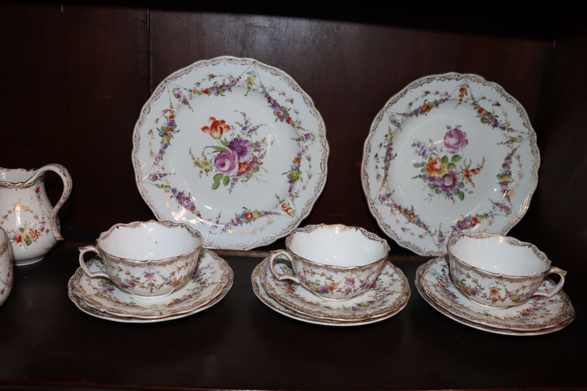 A Meissen part tea set, having painted foliate sprays heightened in gilt within shaped borders, - Image 5 of 9