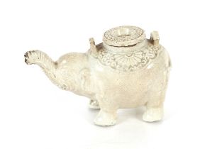 A Chinese blanc de chine water dropper in the form of an elephant, having moulded decoration to