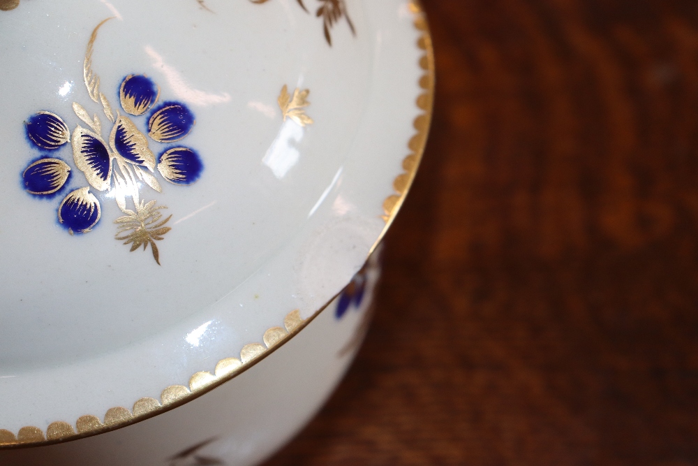 A 19th Century English porcelain part tea set having blue floral decoration heightened in gilt, - Image 13 of 33