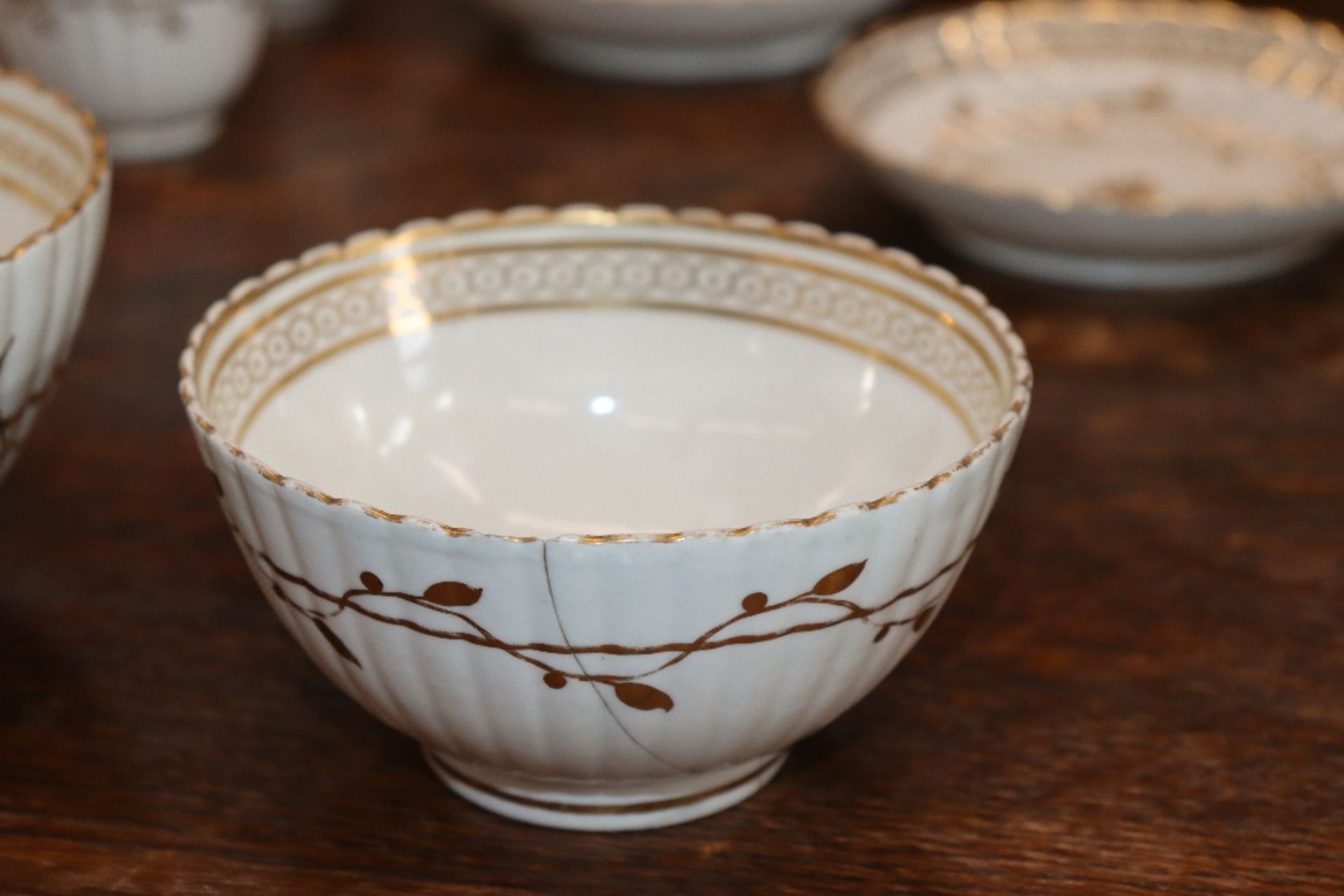 An early 19th Century English porcelain part tea set, of fluted design comprising numerous cups, - Image 14 of 32