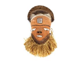 Four Ethnic painted face masks, having Hessian and woven head pieces, painted tribal markings