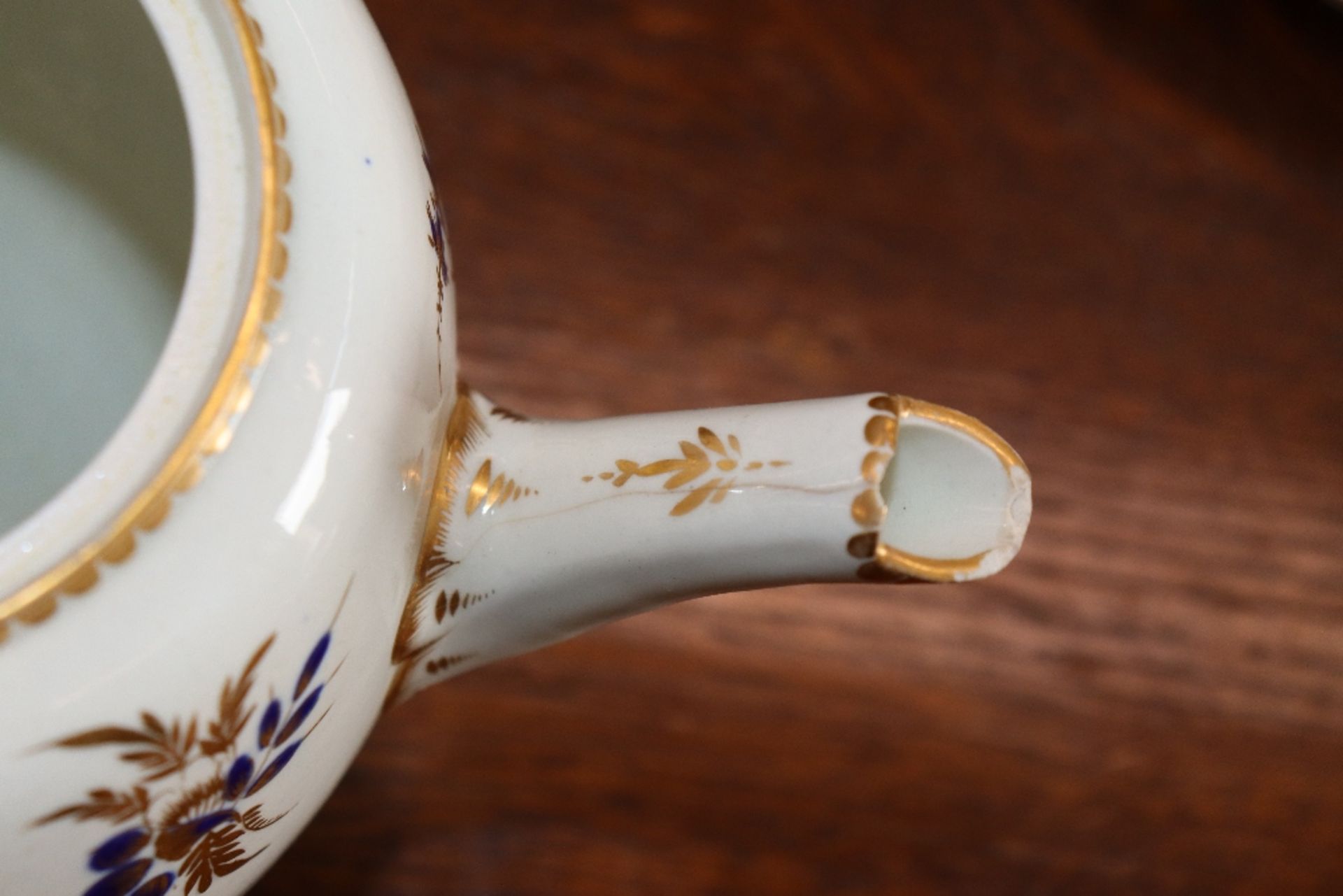 A 19th Century English porcelain part tea set having blue floral decoration heightened in gilt, - Image 29 of 33