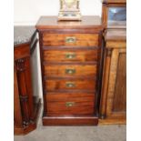 A mahogany chest of narrow proportions fitted five graduated drawers, with sunken brass military