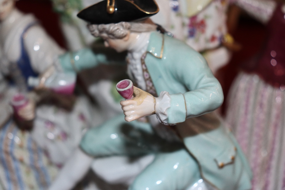 A large 19th Century Meissen figure group depicting villagers dancing and drinking before a floral - Image 5 of 18