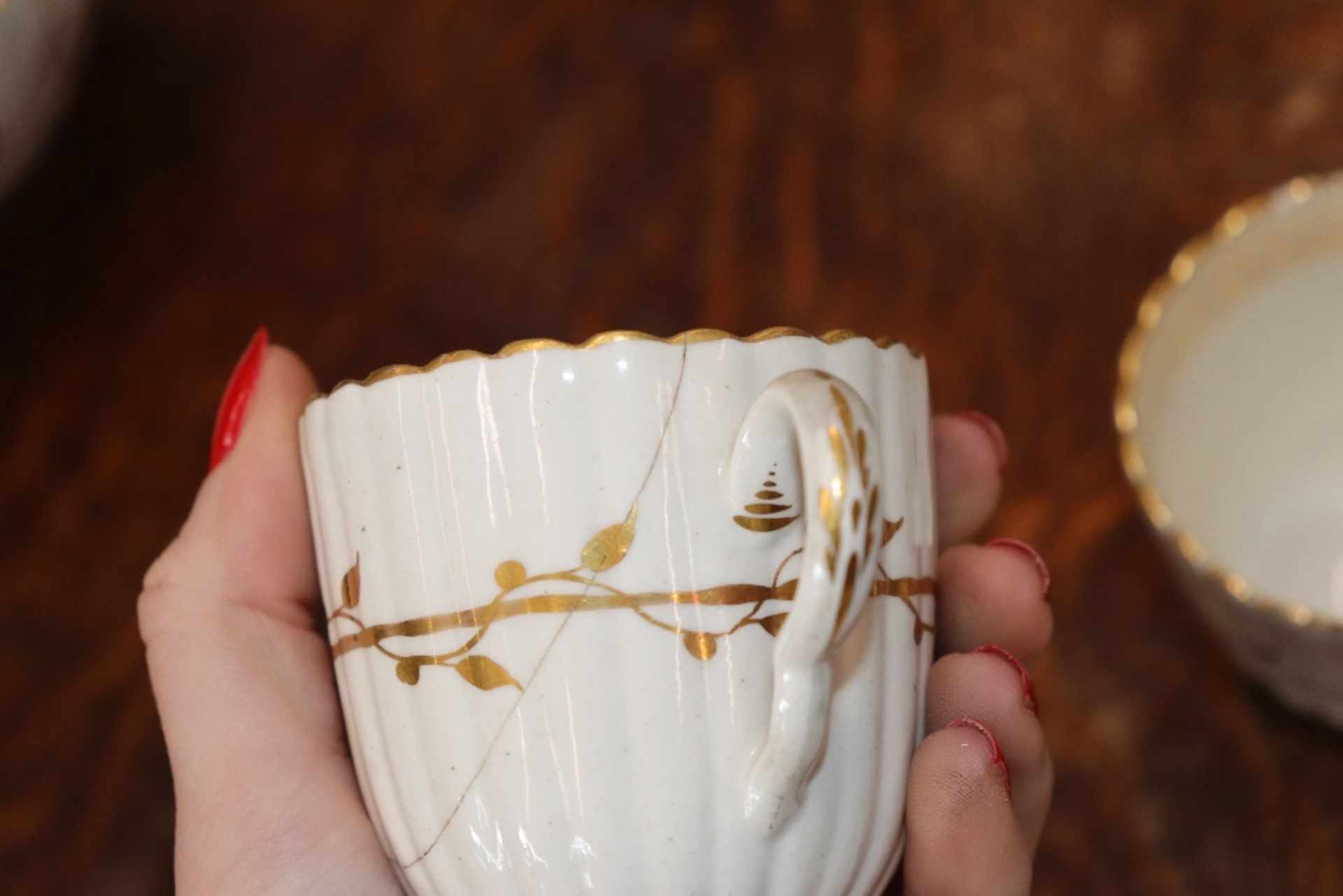 An early 19th Century English porcelain part tea set, of fluted design comprising numerous cups, - Image 30 of 32