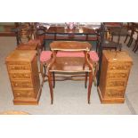 A pair of walnut and chequer banded bedside chests, fitted brushing slides and four drawers,
