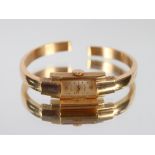 An Orsa 18ct gold cased bangle watch, 11gms total weight