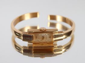 An Orsa 18ct gold cased bangle watch, 11gms total weight