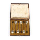 A cased set of six silver bean topped coffee spoons