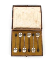 A cased set of six silver bean topped coffee spoons