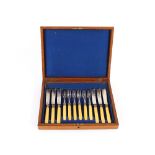 An oak canteen case by Army & Navy CSL and contents of various plated cutlery; and an oak cased