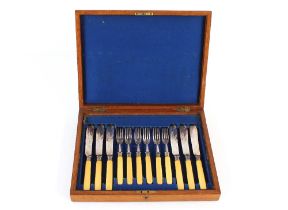 An oak canteen case by Army & Navy CSL and contents of various plated cutlery; and an oak cased