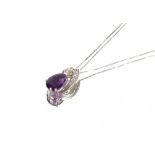 A 9ct white gold diamond and amethyst set necklace, hung to a fine link chain