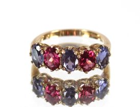 A 9ct gold ring, set amethyst and garnets, ring si