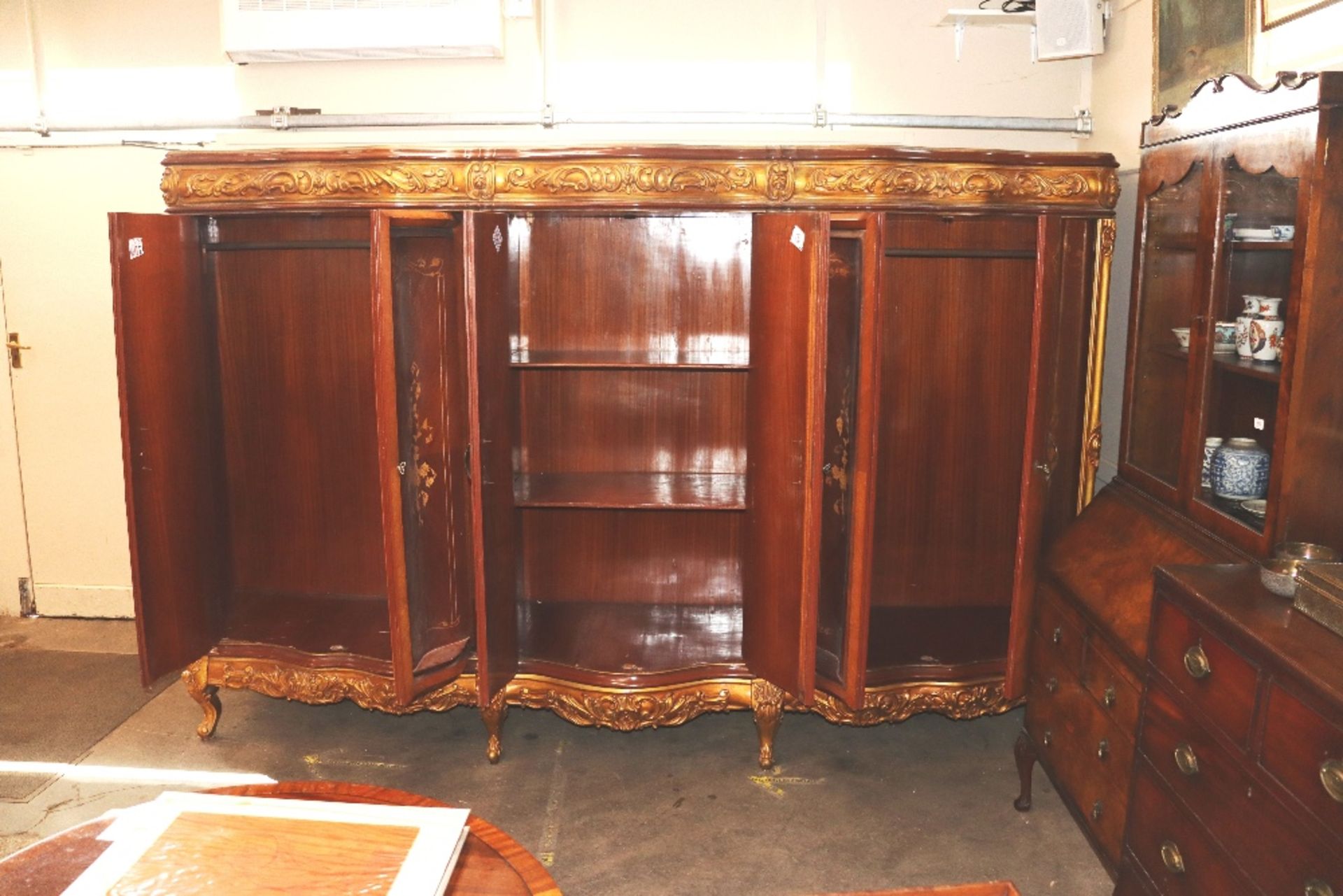 A large and unusual French marquetry and gilt decorated quadruple wardrobe of serpentine form, - Image 2 of 2