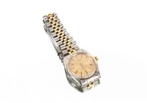 A Rolex Bi-Metallic date adjust Oyster Perpetual wrist watch