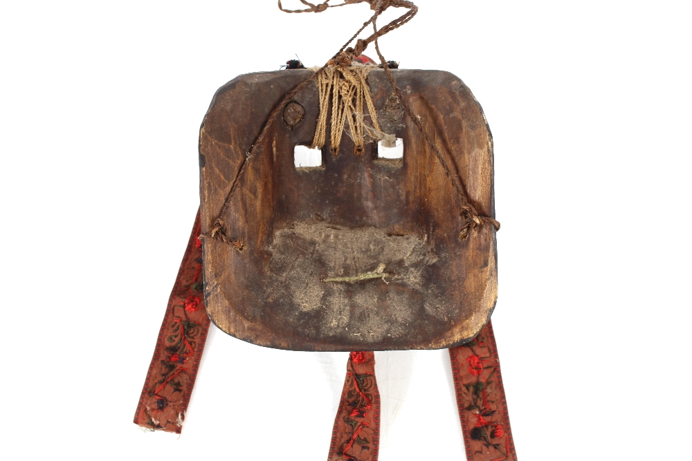 A brightly coloured Ethnic face mask, having horns supporting a central bell with brightly - Image 3 of 3