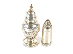 A silver baluster pepperette, Birmingham 1902; and a small silver bullet shaped pepper pot,