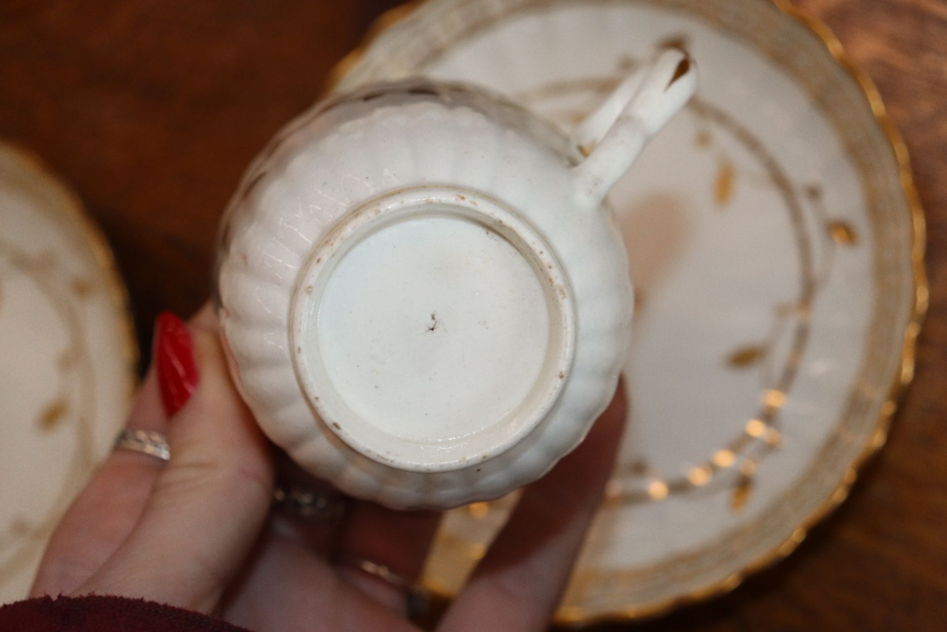 An early 19th Century English porcelain part tea set, of fluted design comprising numerous cups, - Image 4 of 32