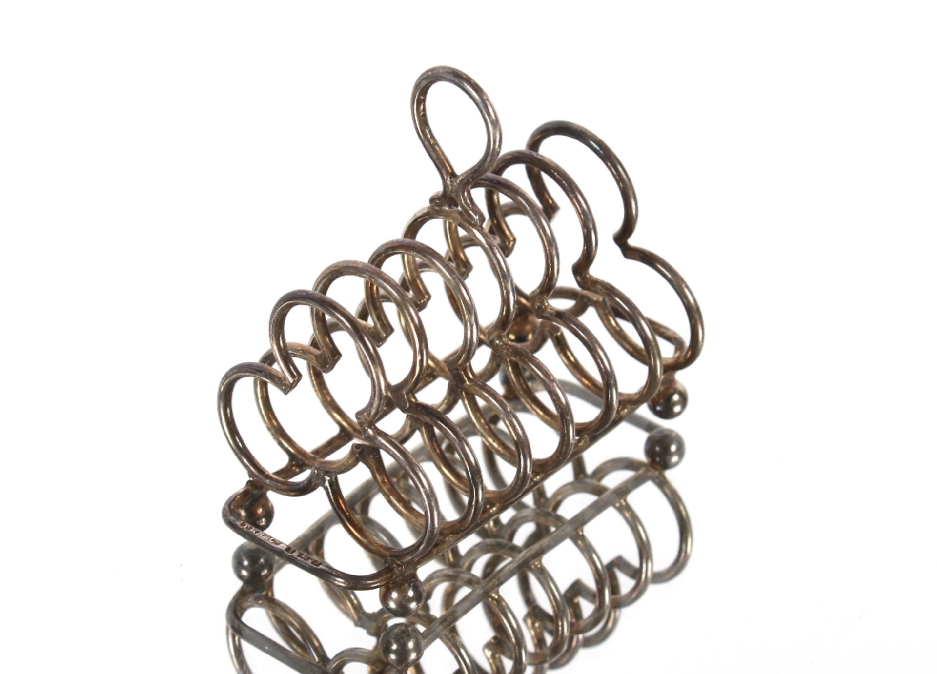 A miniature silver six division toast rack, Birmingham 1903