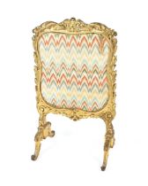 A 19th Century gilt Rococo style fire screen with needlepoint tapestry panel, 60cm wide x 101cm high