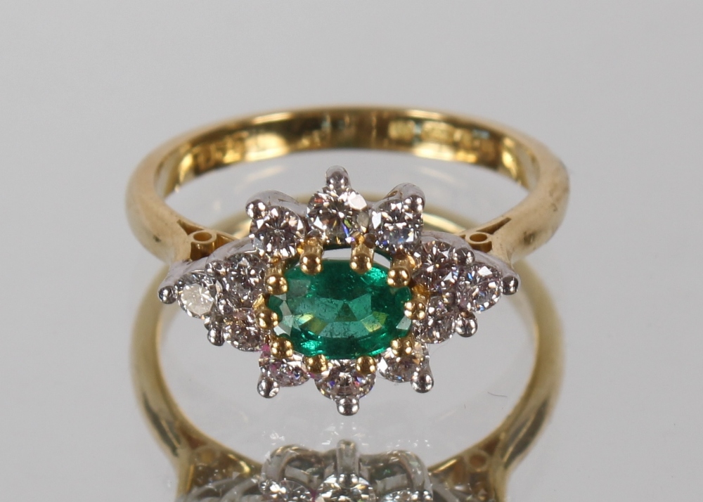 A diamond and emerald cluster ring, in 18ct gold mount, 3.4gms